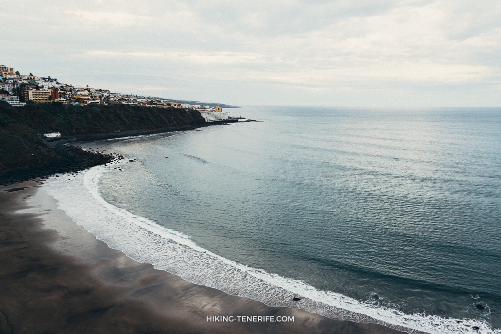 West Tenerife coastline near Los Gigantes with dark sand and calm sea