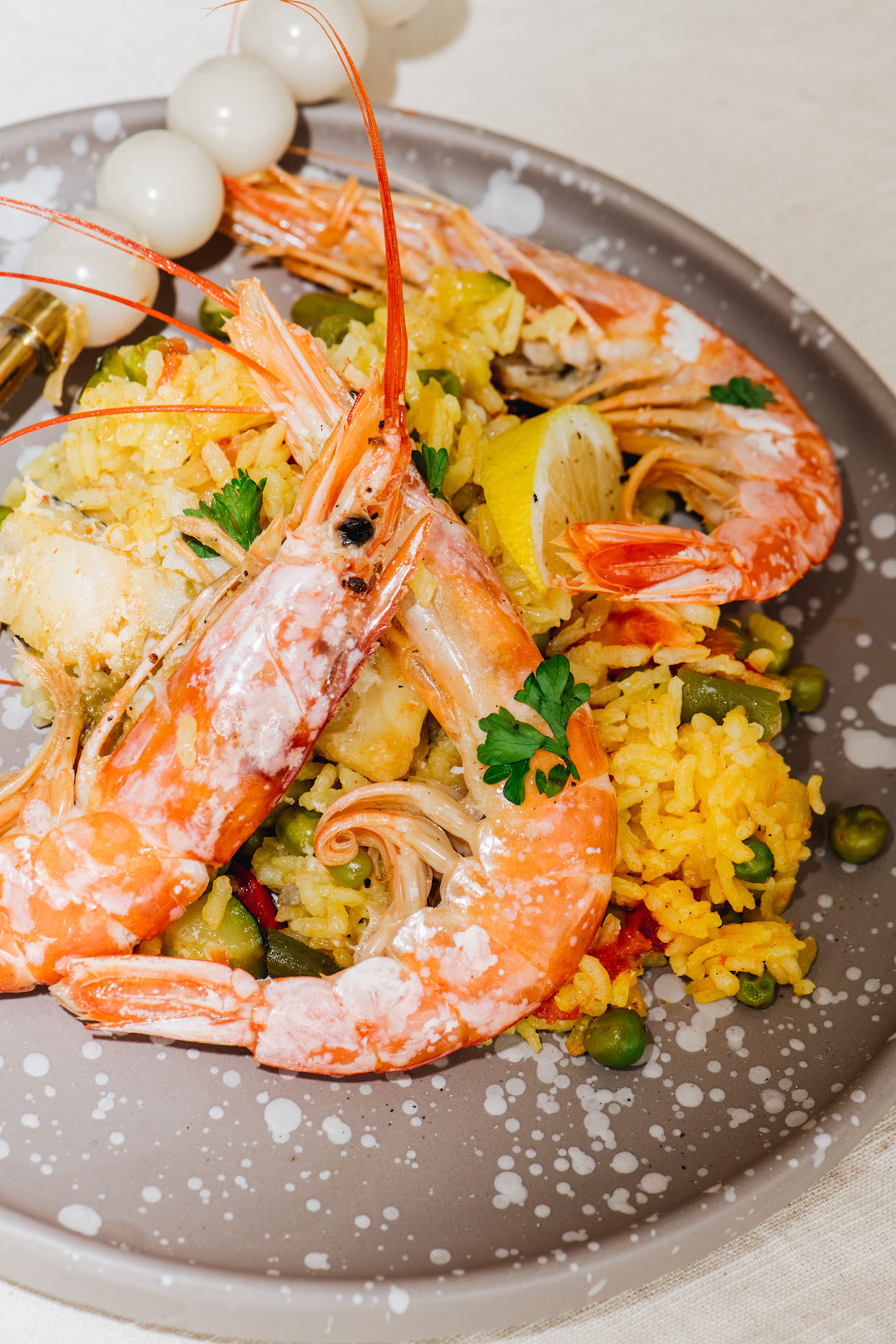 Tenerife seafood paella with prawns lemon parsley and red wine